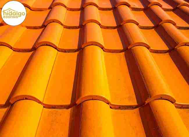 Clay roof tiles installed in overlapping pattern