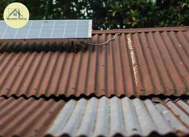 Rusty metal roof with solar panel wiring.